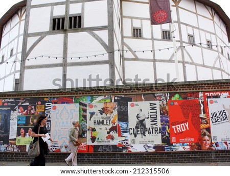 London - Aug 17: People passing posters advertising plays at The Globe Theater on 21st August 2014. The theater, a reconstruction of Shakespeare\'s original globe, opened for performances in 1997