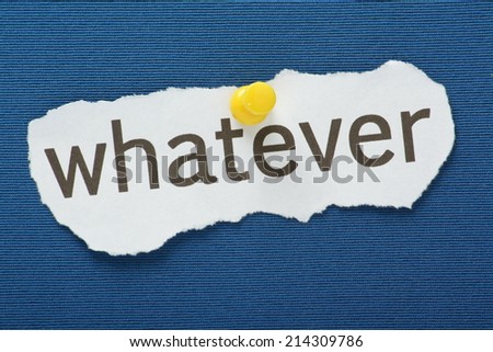 The phrase Whatever typed on a piece of torn paper and pinned to a blue notice board
