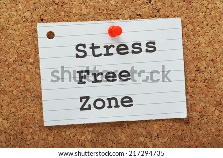 The phrase Stress Free Zone typed on a piece of lined paper and pinned to a cork notice board as a reminder