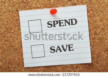 Tick Boxes for the choices to Spend or Save on a piece of lined paper pinned to a cork notice board