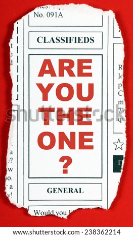 The question Are You The One? on a newspaper clipping from the classified advertising section