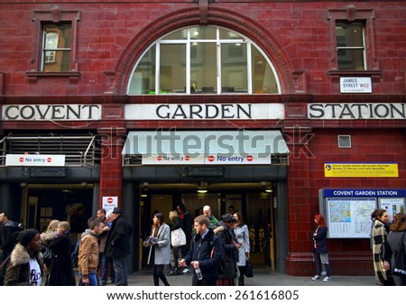 London, England - March 17, 2015: People exiting and passing by the Covent Garden Underground Station in London, England. Covent Garden is visited by thirty million tourists each year.