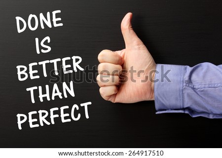 The phrase Done is Better Than Perfect on a blackboard with a hand giving a thumbs up gesture, as a reminder it is sometimes better to finish and move on to the next challenge