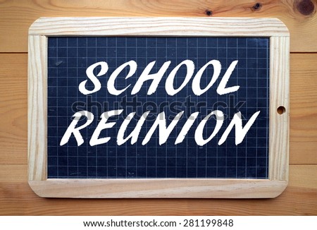 The phrase School Reunion in white text on a slate blackboard