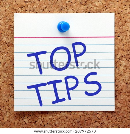 The phrase Top Tips in blue text on an index card pinned to a cork notice board as a reminder