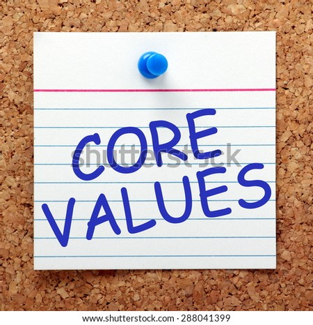 The phrase Core Values in blue text on an index card pinned to a cork notice board as a reminder