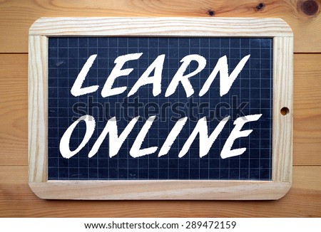 The phrase Learn Online in white text on a blackboard