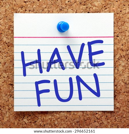 The phrase Have Fun in blue text on an index card pinned to a cork notice board as a reminder