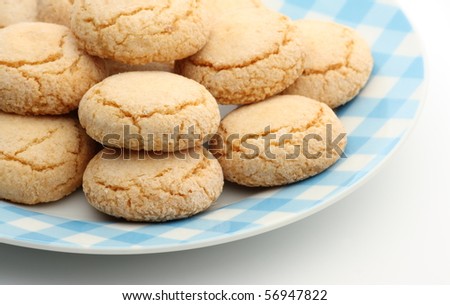 Traditional Italian Ameretti biscuits on a patterned plate