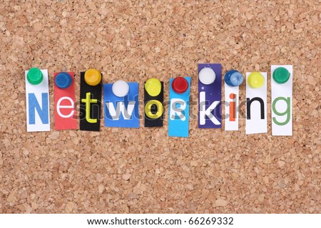 The word Networking in cut out magazine letters pinned to a cork notice board as a concept for communication in business and social relationships