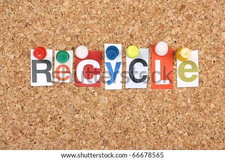 The word Recycle in cut out magazine letters pinned to a cork notice board