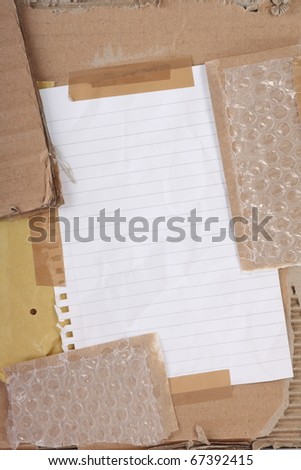 A collage of cardboard,bubble wrap,adhesive tape and paper to form a textured background with copy space