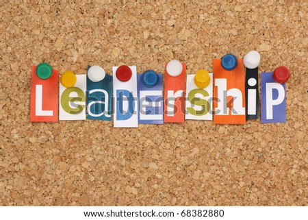 The word Leadership in cut out magazine letters pinned to a cork notice board