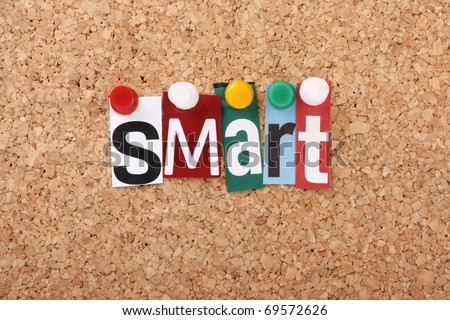 The word Smart in cut out magazine letters pinned to a cork notice board, representing the business concept of Smart Goals, Specific,Measurable,Achievable,Realistic and Timely