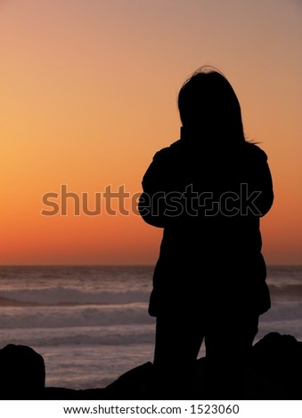 Woman watching the sun go down