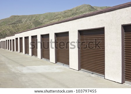 Brown storage units in a long strip row.