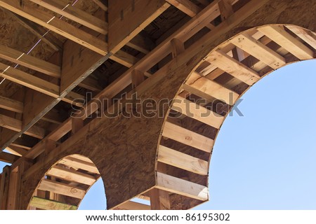 Wooden arch is under construction in a house.