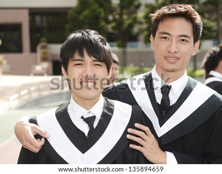 Asian graduates on campus