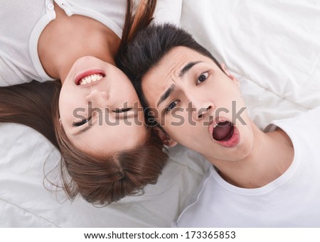Young man and young woman. Couple sleeping in bed.