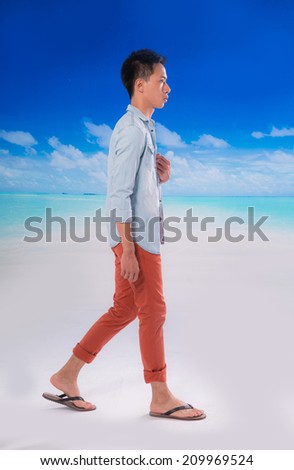 Full body handsome young man and Flip Flops walking at beach background