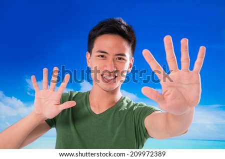 Young man with hands gesture in outdoor