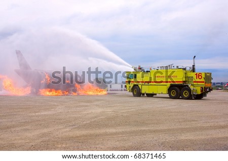 MISSISSAUGA, ONTARIO, CANADA - JULY 14: Fire and Emergency Services Training Institute (FESTI) fire truck fights a burning plane on July 14, 2007 in Mississauga, Canada.