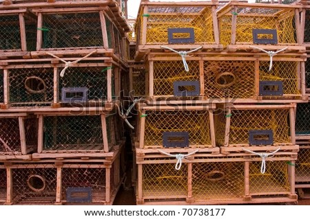 Four rows of rectangular lobster traps, composition with rule of thirds.
