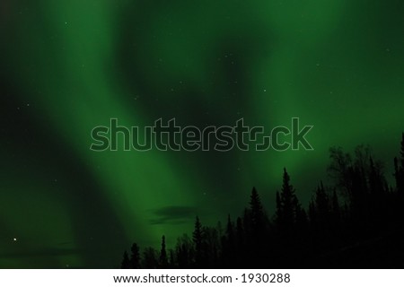 The aurora borealis paints the sky green near Fairbanks, Alaska.