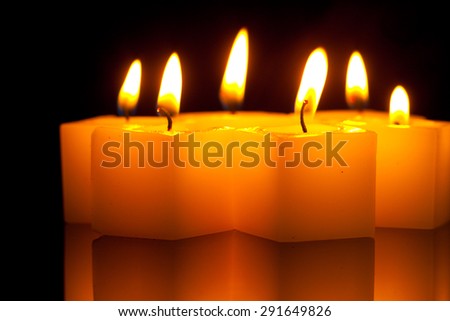 burning candles on a mirrored background, 6 pieces