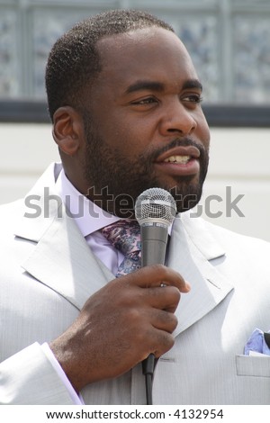 Kwame Kilpatrick speaking at a prayer rally