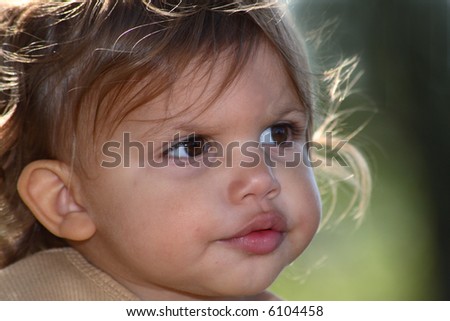 A close-up of a baby\'s puzzled face