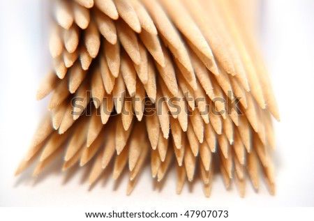 An arrangement of cocktail sticks on a white background