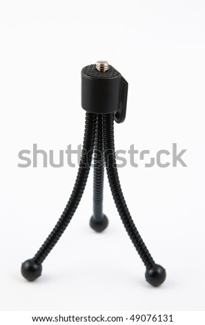 stock photo : A mini flexible bendy camera tripod