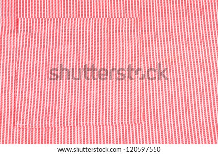 Macro exposure of red and white candy stripe apron with stitched pocket to add interest.