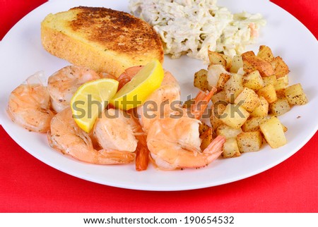 Rule of thumb is that Creole cooking is more refined than Cajun Cooking.  A nice touch on these shrimp is the split shell, making it easier to peel.  Served with homefries and coleslaw.