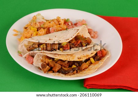 A sensational mix of portobello mushrooms and fajita spices creating a delicious TV Dinner cooked in microwave oven and served with Mexican Rice and sprinkled with Pico de Gallo garnish.