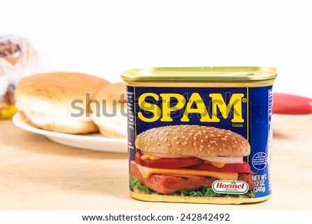 LLANO, TEXAS-Jan 09, 2015:   Hamburger buns on white background with Large can of Hormel Foods SPAM as main ingredient for \
