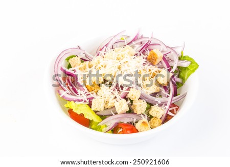 Tossed Garden Salad with lettuce; tomatoes, red onions; croutons; grated cheese on white background.