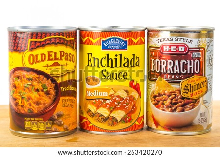 LLANO, TEX-MAR 24, 2015:  Cans of Mexican  Food on white background with copy space.  Enchilada sauce; refried beans; borracho beans.