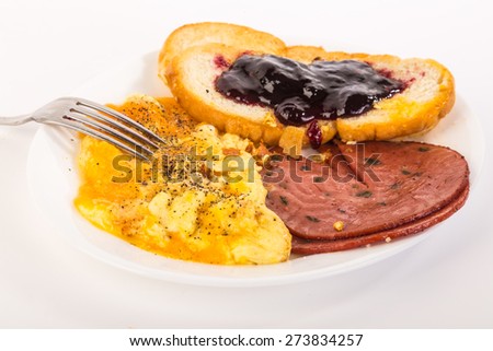 Cheddar Cheese Omelet with fried jalapeno bologna and blackberry jam on toasted french bread.