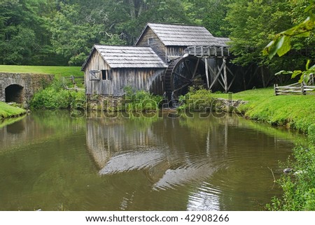 Old Mabry Mill on the Blue Ridge Parkway (Virginia) reflected in the mill pond on an overcast day.  Well saturated color, nice light.