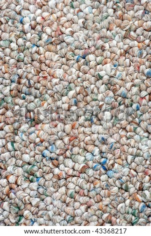 Very sharp closeup of a multi-colored knit carpet.