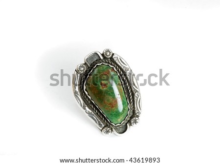 Handmade and crafted by Native Americans this beautiful green turquoise stone is set in a silver ring. The green variety of turquoise is preferred by many collectors.