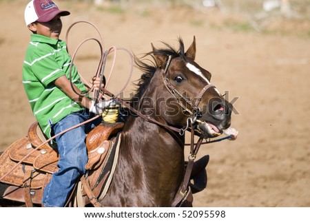 LLANO, TX -- APRIL 18: Young cowboy misses the calf at the Llano Crawfish Open Team Roping competition held in Llano, Texas on April 18, 2008.