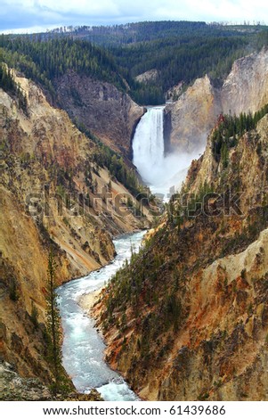 Spray and mist rising hundreds of feet above the impact of Yellowstone River Lower Falls as the river cuts its way through the Grand Canyon of Yellowstone.