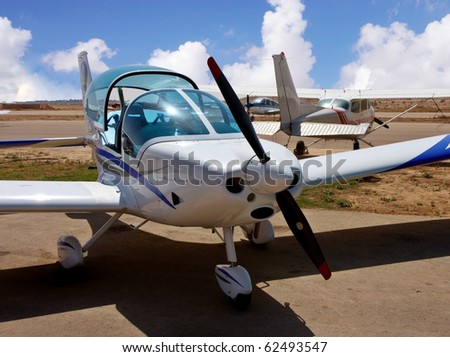 Small airplane with a propeller in    desert airport