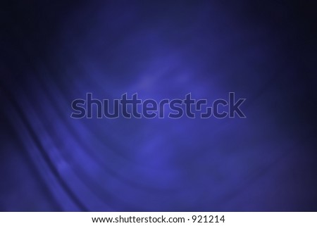 Electric blue backdrop with folds.