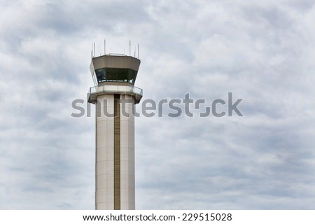 FAA control tower at the Buffalo Niagara International Airport, in Buffalo, NY. Tower is framed against a cloudy sky
