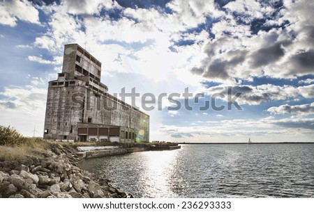 Abandoned grain elevator on the shores of Lake Erie outside of Buffalo, New York. Image is filtered high contract / HD style.
