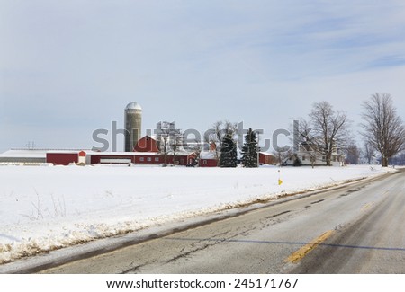 Modern farm in surrounded by the snow-covered fields of Western New York.